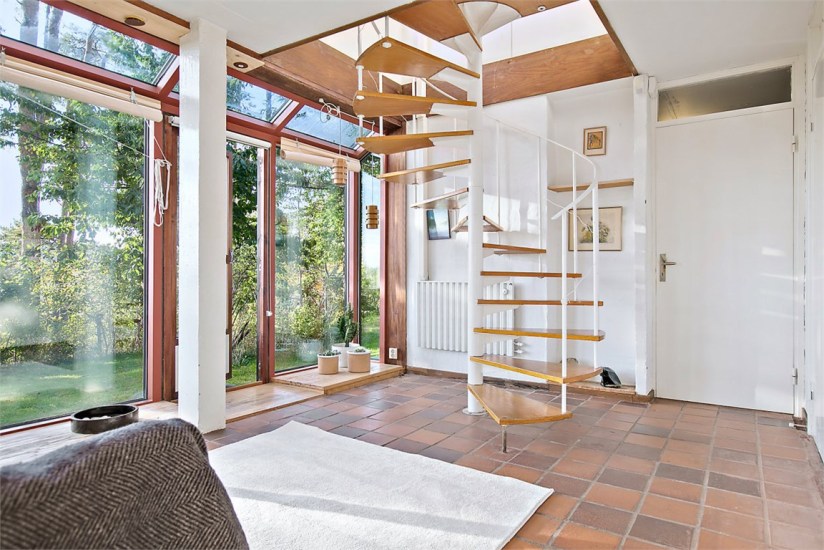 1960s architect-designed modernist property in sweden - spiral staircase tiled floor